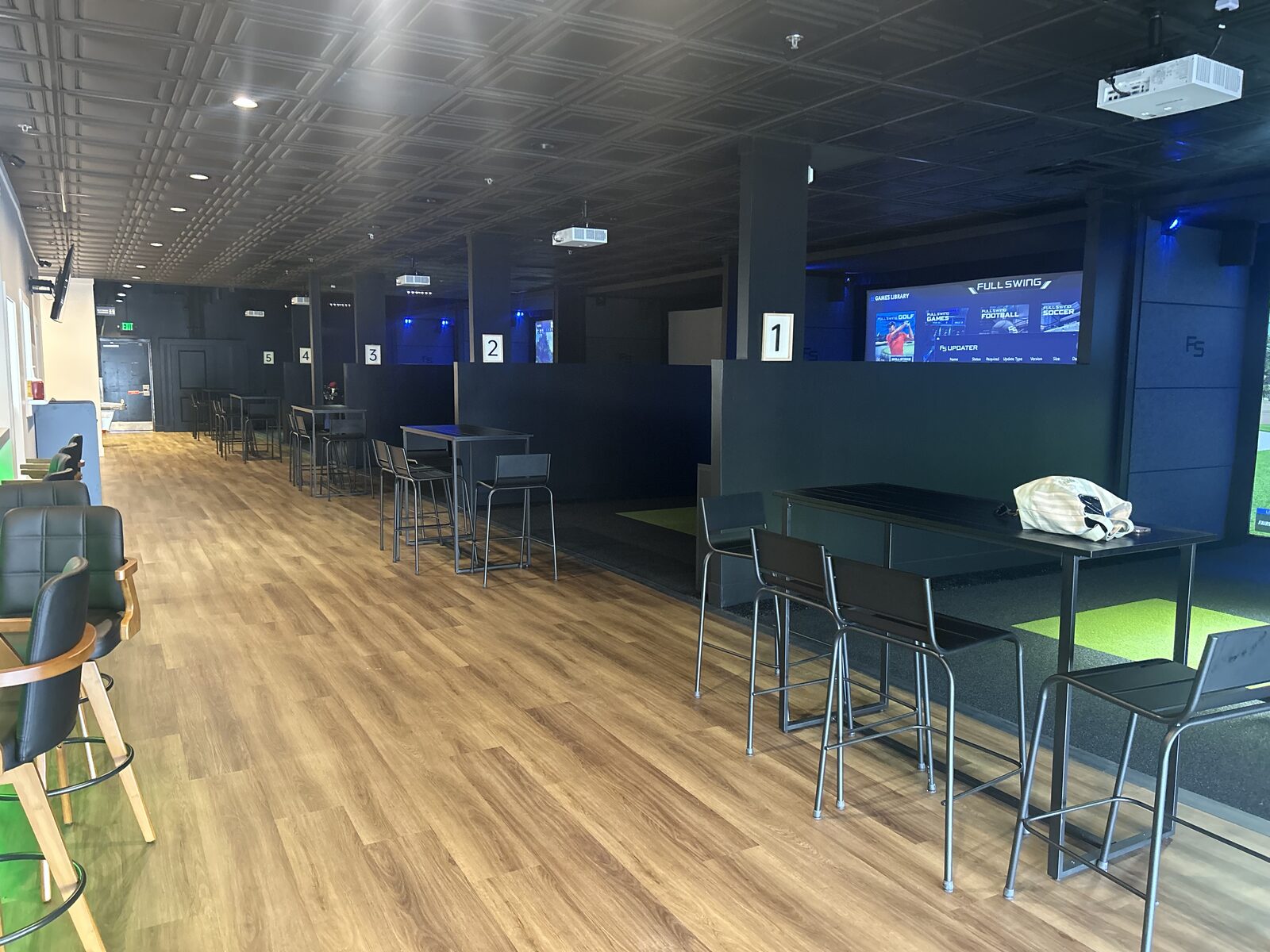 Indoor golf simulator bays at Way Right Golf in Geneseo, NY